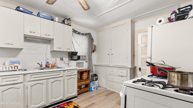 14 Hall St, North Adams, MA 01247 - kitchen featuring white appliances, a sink, light wood-style flooring, and white cabinets