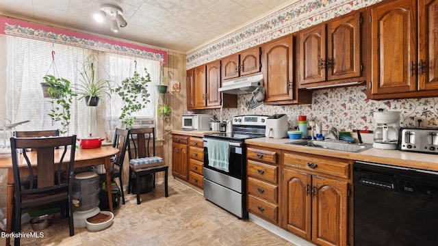 14 Hall St, North Adams, MA 01247 - kitchen with stainless steel electric range oven, dishwasher, a sink, under cabinet range hood, and light countertops