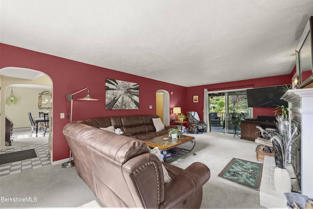 785 E New Lenox Rd, Pittsfield, MA 01201 - living area featuring arched walkways, a fireplace, and carpet floors