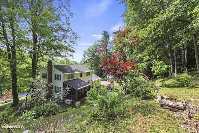 785 E New Lenox Rd, Pittsfield, MA 01201 - rear view of property with a sunroom, a chimney, and roof with shingles