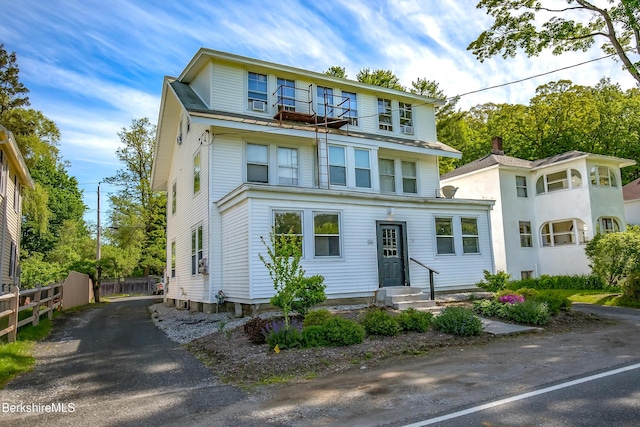 view of front of property with a balcony