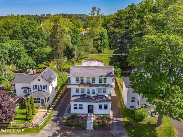 view from above of property with a heavily wooded area