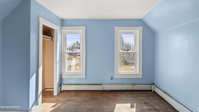 469 Pecks Rd, Pittsfield, MA 01201 - additional living space featuring a baseboard heating unit, hardwood / wood-style flooring, and vaulted ceiling