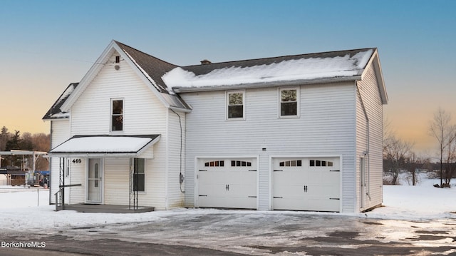 view of front of property with a garage