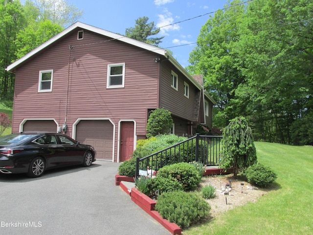 499 Tamarack Rd, Pittsfield, MA 01201 - view of property exterior featuring an attached garage, asphalt driveway, and a yard