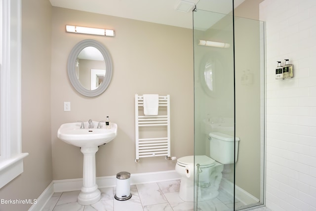 bathroom with toilet, a stall shower, radiator heating unit, and baseboards