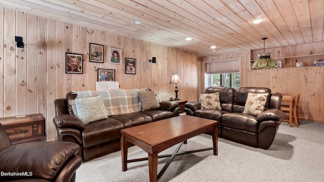 living area with recessed lighting, light colored carpet, wooden ceiling, and wood walls