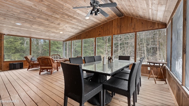 sunroom featuring wood ceiling, a ceiling fan, and vaulted ceiling