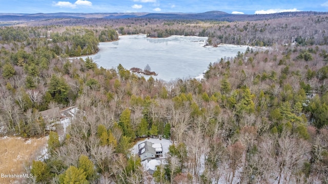 birds eye view of property with a forest view