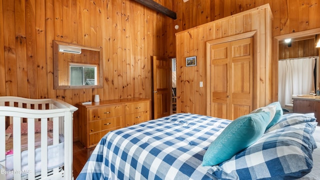 bedroom with wooden walls