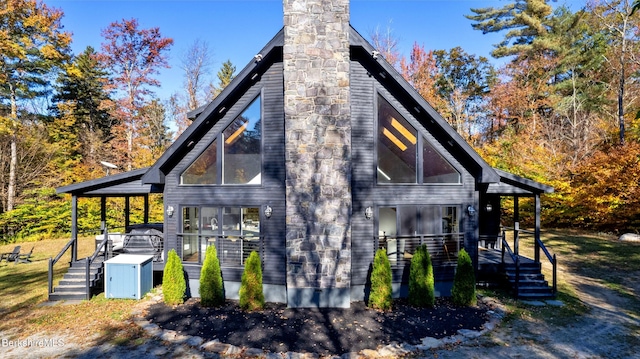 view of side of property featuring a porch