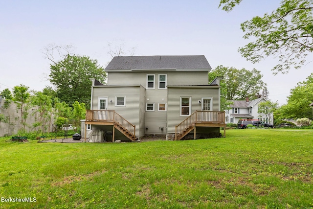 24 Front St Unit 22-24, Williamstown, MA 01267 - rear view of house with stairway, a wooden deck, and a yard