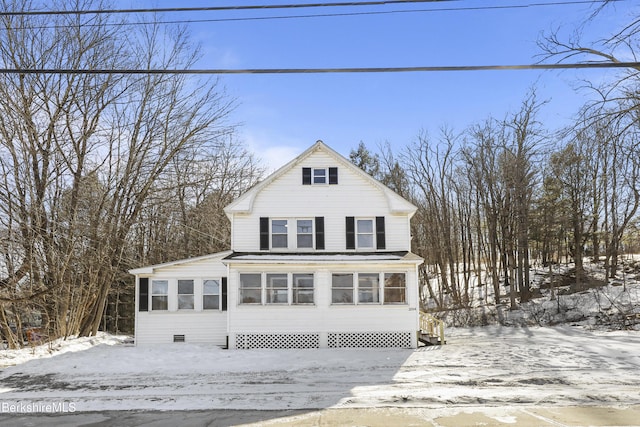 view of front of property with crawl space and a sunroom