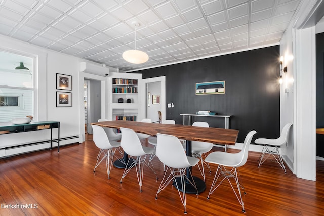 49 S St, Great Barrington, MA 01230 - dining area with baseboards, built in features, wood finished floors, and a wall unit AC