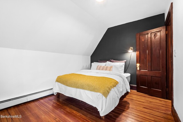 49 S St, Great Barrington, MA 01230 - bedroom featuring a baseboard radiator, vaulted ceiling, and wood finished floors
