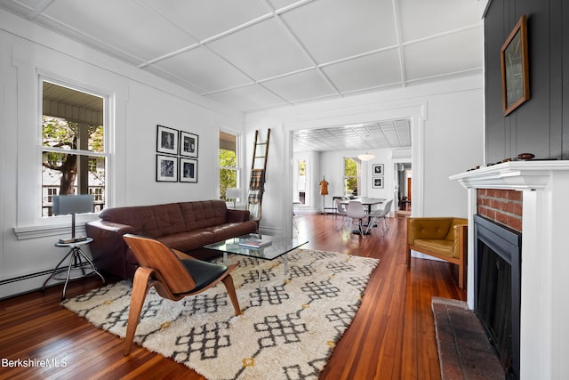 49 S St, Great Barrington, MA 01230 - living area with a brick fireplace and dark wood finished floors