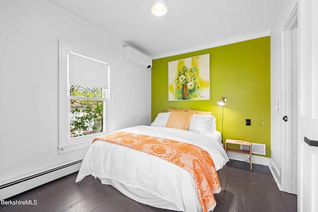 49 S St, Great Barrington, MA 01230 - bedroom with an AC wall unit, dark wood-style flooring, a baseboard heating unit, and visible vents