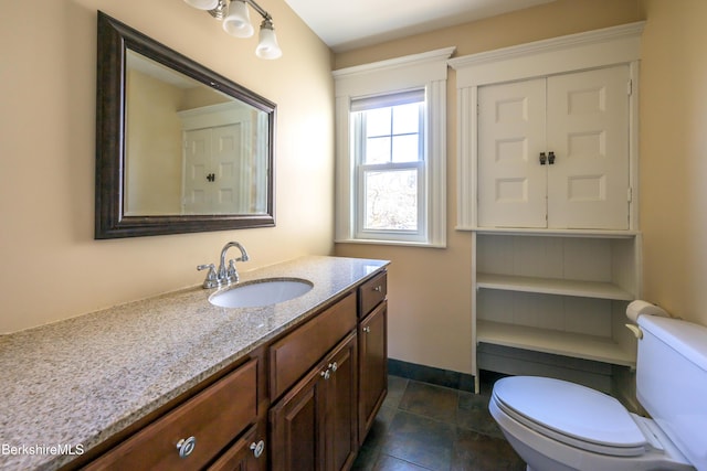 92 Elm St, Pittsfield, MA 01201 - bathroom with baseboards, toilet, and vanity