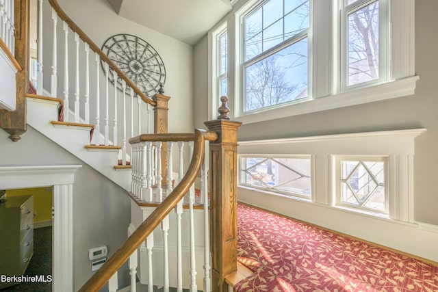 92 Elm St, Pittsfield, MA 01201 - stairway featuring a high ceiling and carpet floors