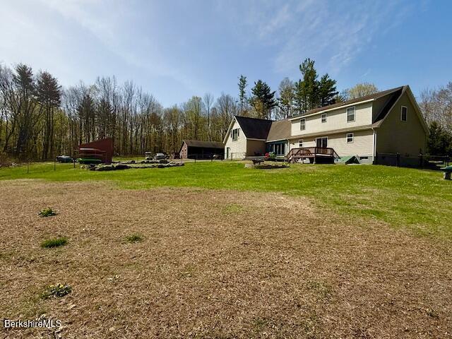 view of yard with a wooden deck