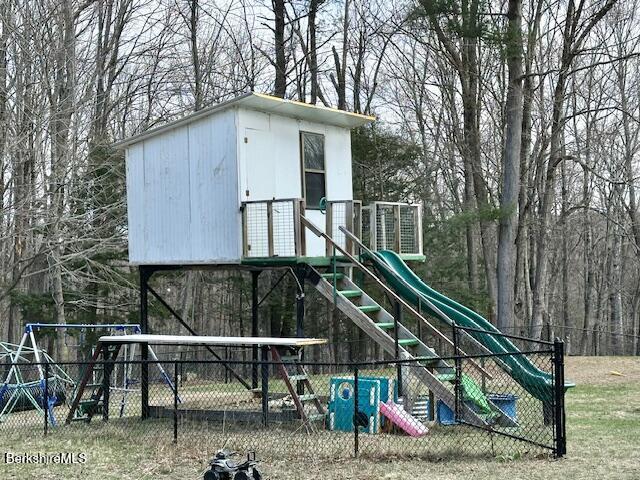 view of playground featuring fence