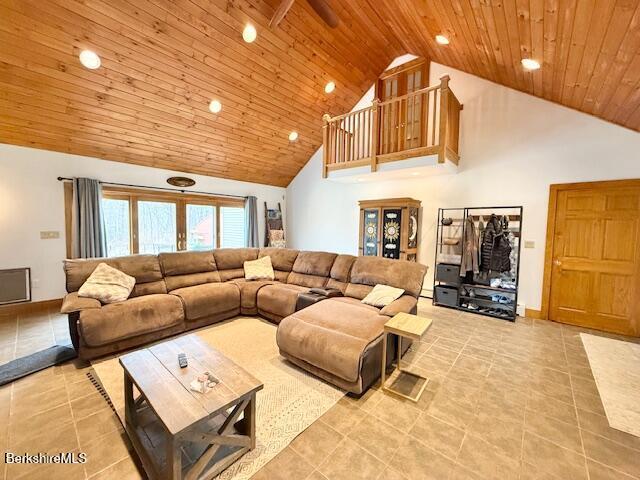living room with wood ceiling, french doors, light tile patterned floors, high vaulted ceiling, and recessed lighting