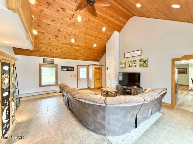 living area featuring ceiling fan, light tile patterned floors, wooden ceiling, high vaulted ceiling, and recessed lighting