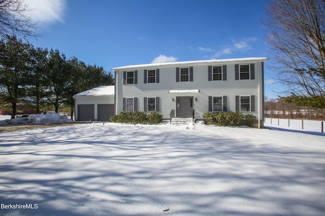 colonial inspired home with a garage