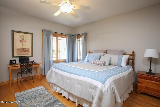 bedroom with ceiling fan and light hardwood / wood-style flooring