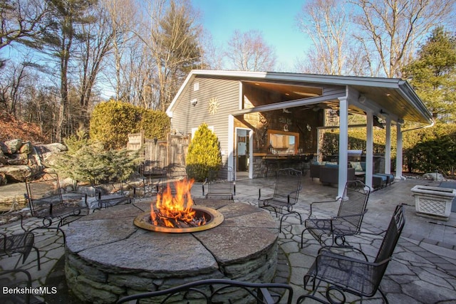 view of patio / terrace with an outdoor fire pit