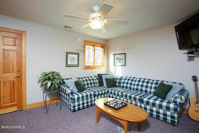 living room featuring carpet and ceiling fan