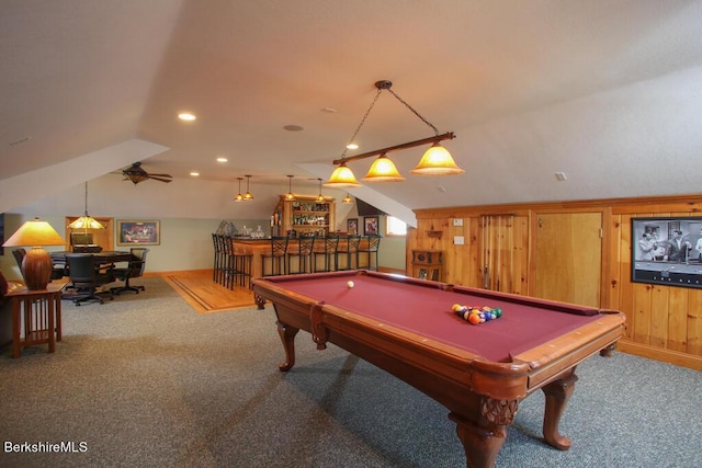 recreation room featuring carpet flooring, wooden walls, lofted ceiling, and billiards