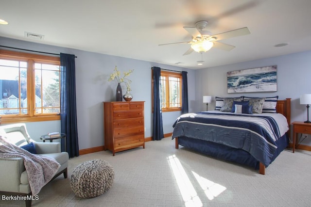 bedroom featuring ceiling fan and light carpet