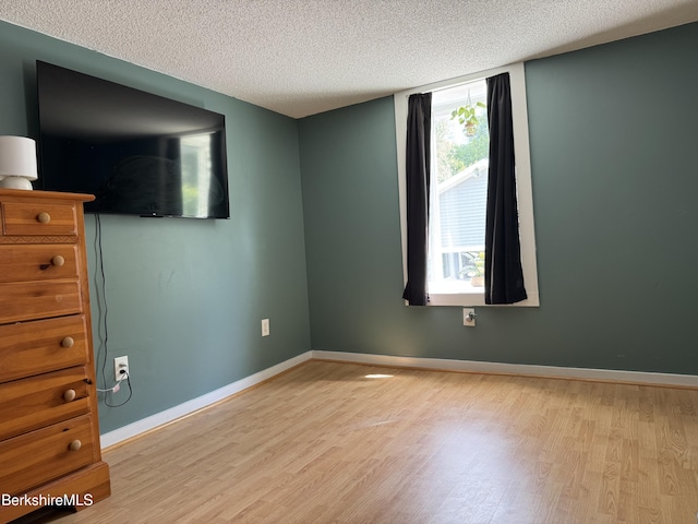 9 Dwight St, Pittsfield, MA 01201 - unfurnished room featuring wood finished floors and a textured ceiling