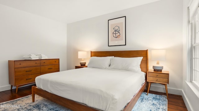 bedroom featuring dark hardwood / wood-style floors