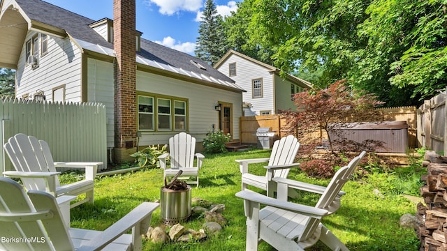 back of house featuring a lawn