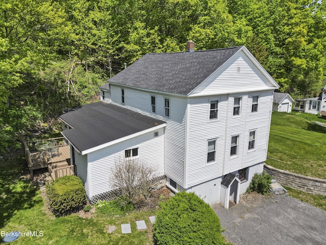 203-205 Main St, Hancock, MA 01237 - view of front of property with roof with shingles, a front lawn, a wooden deck, a view of trees, and a chimney
