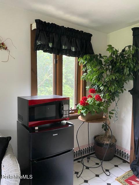 16 Woodlawn Ave, North Adams, MA 01247 - detailed view of freestanding refrigerator and tile patterned floors