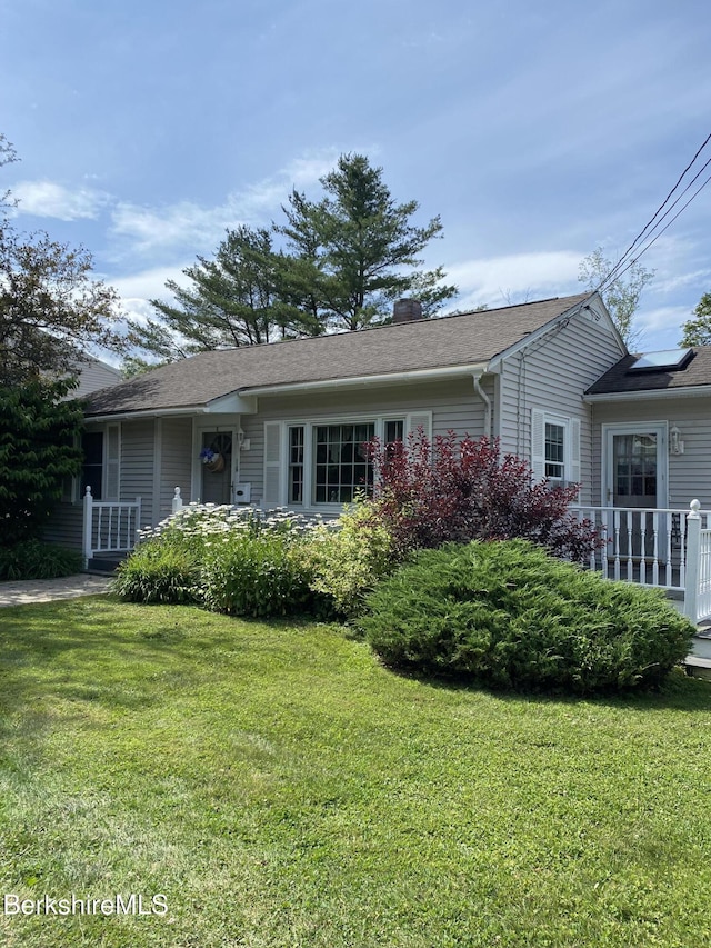 16 Woodlawn Ave, North Adams, MA 01247 - view of front facade featuring a front yard and a chimney