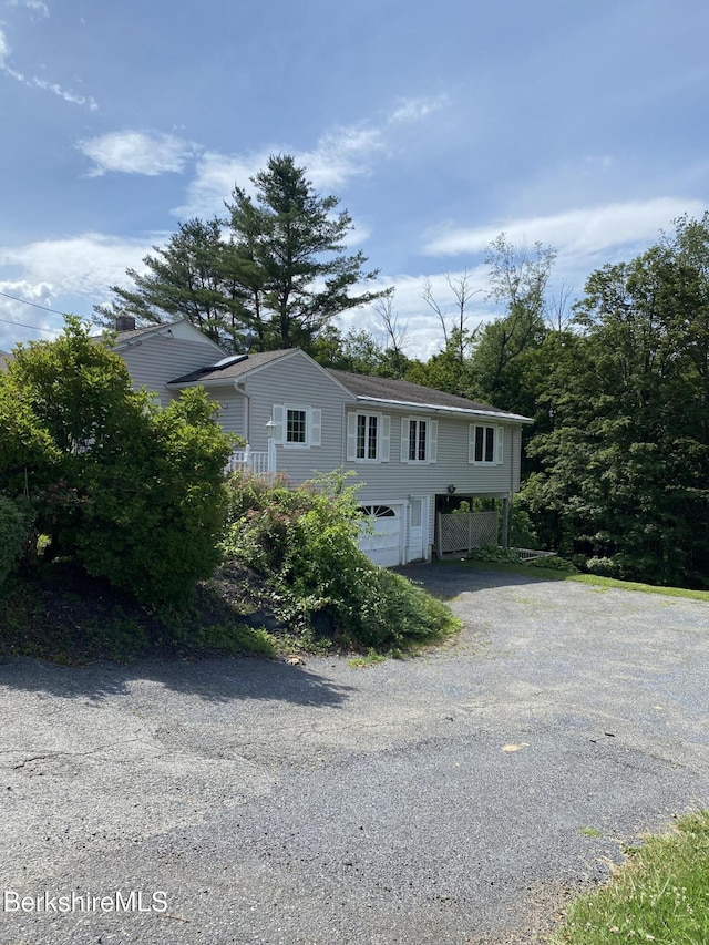 16 Woodlawn Ave, North Adams, MA 01247 - view of front of house featuring asphalt driveway and an attached garage