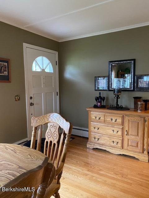 16 Woodlawn Ave, North Adams, MA 01247 - dining room featuring ornamental molding, light wood-style flooring, and baseboard heating
