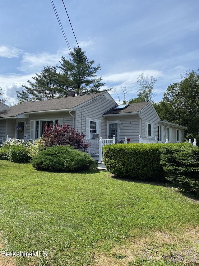 16 Woodlawn Ave, North Adams, MA 01247 - rear view of property featuring a yard and roof with shingles