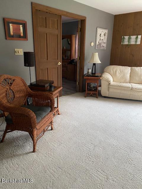 16 Woodlawn Ave, North Adams, MA 01247 - sitting room with carpet and wooden walls