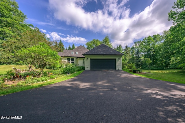 26 N Egremont Rd, Great Barrington, MA 01230 - view of front of house with asphalt driveway, a garage, and a front lawn