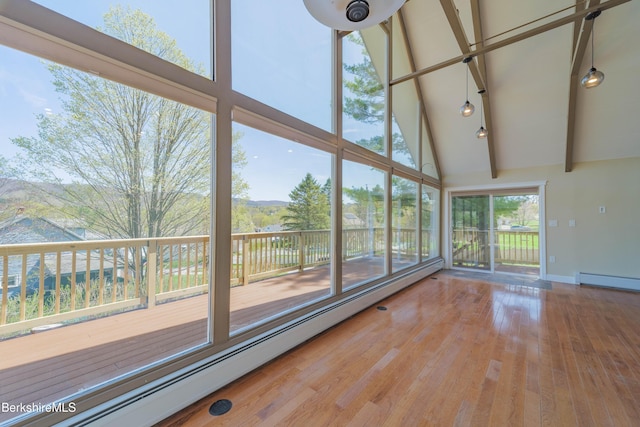 unfurnished living room with baseboard heating, wood finished floors, high vaulted ceiling, baseboards, and beamed ceiling