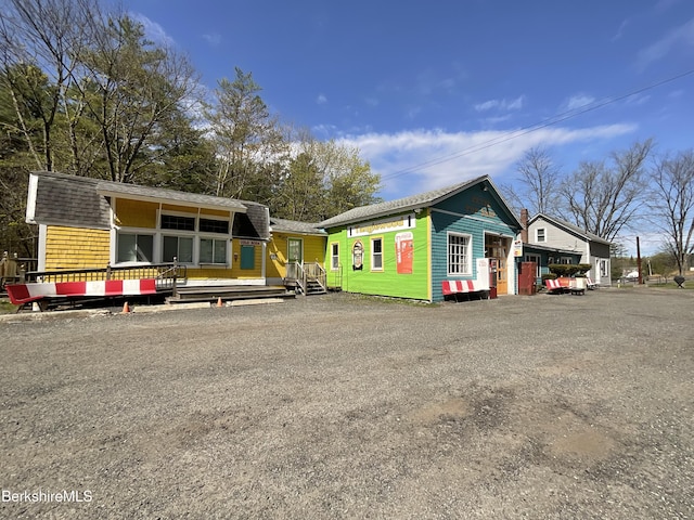 395 Laurel St, Lee, MA 01238 - view of front of property featuring an outbuilding and roof with shingles