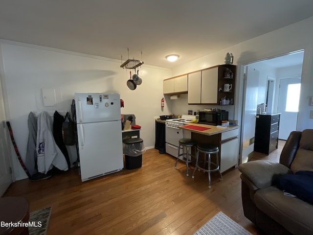 395 Laurel St, Lee, MA 01238 - kitchen with white appliances, light wood finished floors, open shelves, and open floor plan