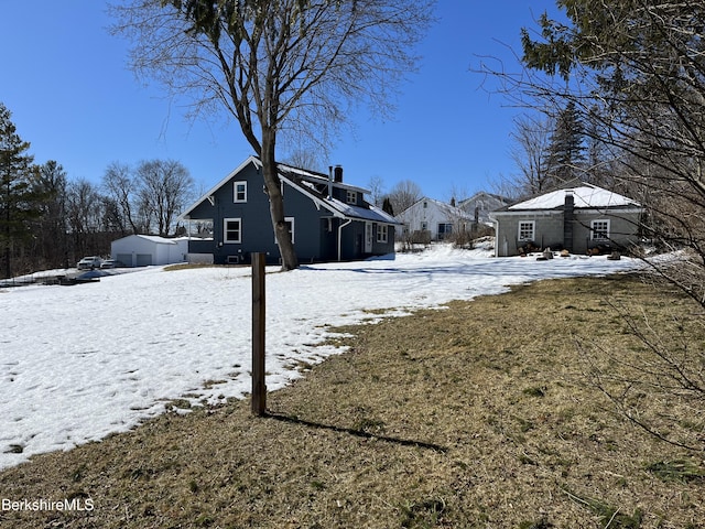 snowy yard with an outdoor structure