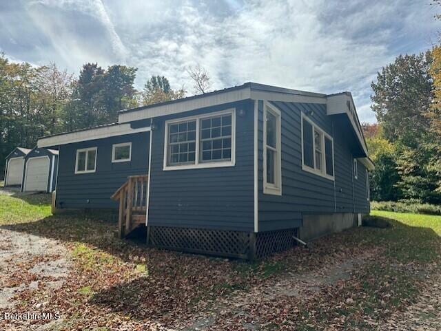 back of property with a garage