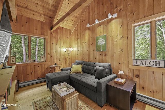 112 Silver St, Lanesborough, MA 01237 - living room featuring baseboard heating, wood ceiling, light wood finished floors, and wood walls